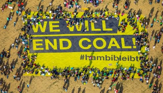 Aerial photo Giant demonstration with WE WILL END COAL hambibleeant banners against the clearing of the Hambacher forest Hambach Hambacher Forst Etzweiler Elsdorf Lignite area Rhineland North Rhine Westphalia Germany ATTENTIONxMINDESTHONORARx60xEURO