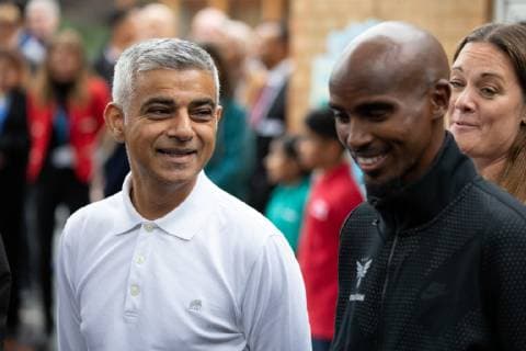October 15, 2018 - London, London, UK - London, UK. Mayor of London Sadiq Khan (left) and British athlete Sir Mohamed Farah (right) launch a campaign at Cubitt Town Junior School to encourage London schools to take part in the Daily Mile initiative. The Daily Mile gets school children exercising outside for 15 minutes a day, to improve their physical, social, emotional and mental health and wellbeing. London UK - ZUMAl94_ 20181015_zaf_l94_053 Copyright: xTomxNicholsonx