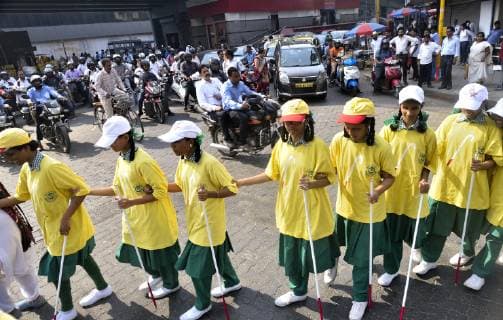 MUMBAI, INDIA - OCTOBER 15: Around 30 students of Kamala Mehta Blind school of Dadar celebrate the World White Cane Safety Day and to create awareness along with Mumbai Police at Parel on October 15, 2018 in Mumbai, India. (Photo by Anshuman Poyrekar Hindustan Times) World White Cane Safety Day