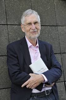 Volker Hage Journalist Author 10 18 thg Volker Hage on 12 October 2018 during the Frankfurt Book Fair Fair Literature Frankfurt Main Germany German German man writer critic literary critic journalism literature german journalism author writer standing tall half smiling smiling holding book