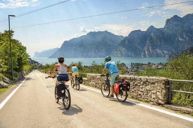 Cyclist on the Via Europa Cycle tour Alpine crossing Via Claudia Augusta View of Turbel Torbole Lake Garda Trentino Italy Europe Copyright: imageBROKER ValentinxWolf ibxvfw04780361.jpg