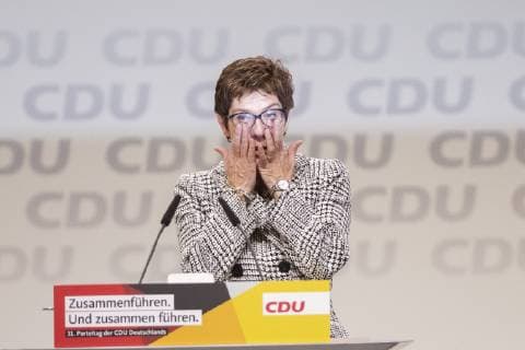 The newly elected CDU chairperson Annegret Kramp Karrembauer C greets the applauding delegate after the announcement of the election results at the 31 CDU Germany party conference at the Hamburg fair on 7 December 2018 31 CDU party conference