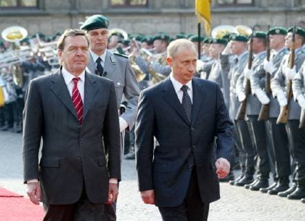 German Chancellor Gerhard Schroeder left and Russian President Vladimir Putin review the honour guard during the welcoming ceremony in Weimar eastern Germany Tuesday April 9 2002 Putin is on a two day visit in Weimar for the German Russian consultations Eckehard Schulz WEIMAR DEU