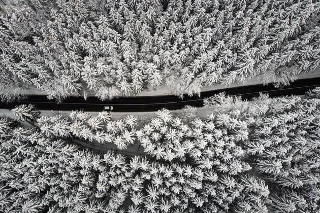 Aerial photo of a road through a forest in winter taken in Reichenbach 11 01 2019 Reichenbach Germany Copyright: xFlorianxGaertnerx