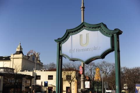 Entrance to the underground from Hasenheide In the background the Hindu temple and the New World Hermannplatz