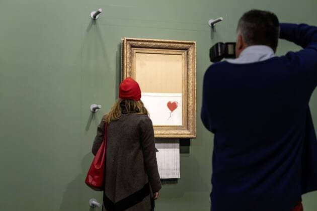 DEU Deutschland Stuttgart 07 03 2019 Staatsgalerie Stuttgart with new attraction The much-hyped artwork Love is in the Bin by street art artist Banksy The director of the Staatsgalerie, Prof Dr Christiane Lange, is right at the presentation The work declared a new icon will be integrated into the collection as a