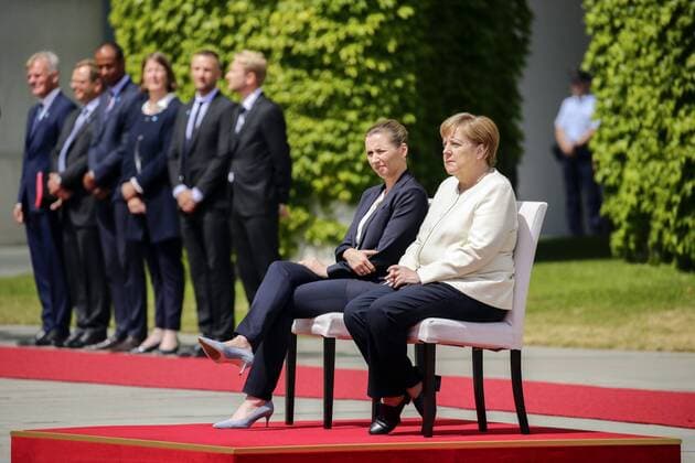 11 07 2019, Berlin, Germany Greeting of the Prime Minister of the Kingdom of Denmark, Mette Frederiksen, by Chancellor Angela Merkel with military honors in the Federal Chancellery Photo of Chancellor Angela Merkel, light jacket, and Mette Frederiksen, Prime Minister of Denmark, decrease the greeting with military honors in the Federal Chancellery while seated