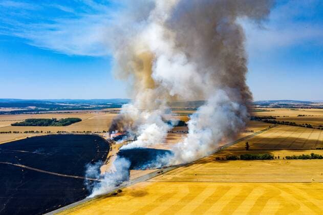 Neudietendorf , 250719 , Large fire of a grain field in Neudietendorf , Emergency forces of surrounding fire brigades fight the blaze , Aerial photograph