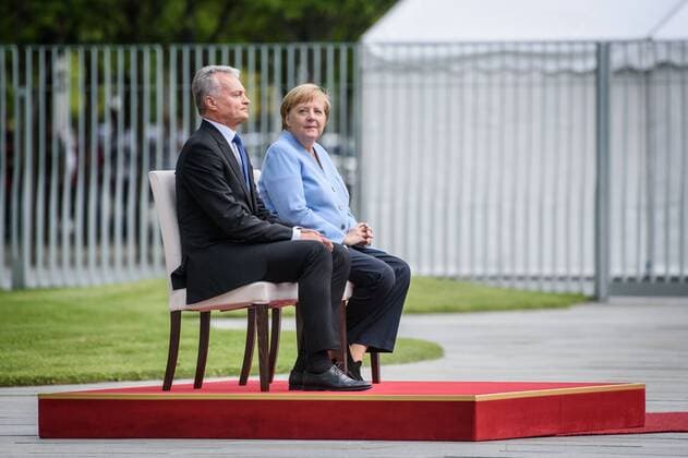 Berlin, Angela Merkel meets the President of the Republic of Lithuania Gitanas Nauseda Germany, Berlin 14 08 2019 The picture shows the German Chancellor Angela Merkel CDU and the President of the Republic of Lithuania Gitanas Nauseda sitting during the reception with military honours in the courtyard of the Federal Chancellery on a chair Berlin Federal Chancellery Berlin Germany