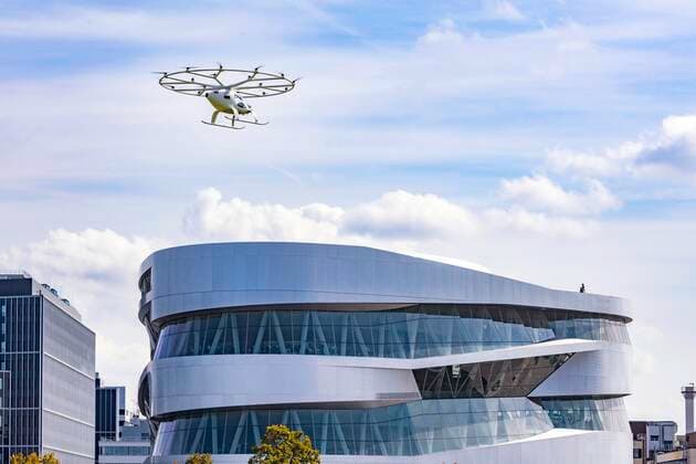 DEU, Germany, Baden Württemberg, Stuttgart, 14 09 2019 Air taxi flies at the Mercedes Museum in Stuttgart According to Daimler AG, this is the first velocopter flight over a major European city The fully electric volocopter flew without passengers The volocopters were developed by the eponymous start-up company in Bruchsal, in which Daimler has been a shareholder since 2017