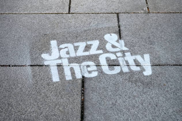 Music experiment of the architect, musician, composer and theorist Christopher Dell, as part of the series of events Jazz The City , on 17 10 2019, in Salzburg Galerie 5020 , Austria The picture shows a lettering of the series of events 2019 Music experiment of the architect, musician, composer and theorist Christopher Dell, sprayed on the floor in fr
