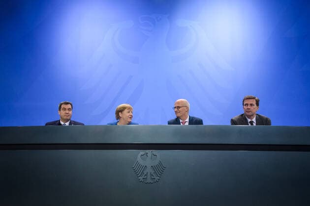 Berlin, press conference with Angela Merkel, Markus Söder and Peter Tschentscher Germany, Berlin 05 12 2019 The picture shows Markus Söder Minister President of the Free State of Bavaria, csu , Angela Merkel German Chancellor, cdu , Peter Tschentscher First Mayo
