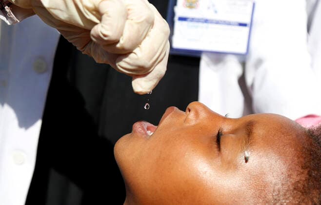 (191224) -- YEMEN, Dec. 24, 2019 (Xinhua) -- A child receives a vaccine against polio during an immunization campaign against polio in Sanaa, Yemen, Dec. 24, 2019. Yemen s health authorities on Monday launched a national polio immunization campaign targeting over 5.5 million children. Supported by the World Health Organization (WHO) and the United Nations Children s Fund (UNICEF), the campaign was inaugurated simultaneously in the Yemeni capital Sanaa and other provinces. The three-day vaccination process went from house to house to immunize children under the age of five. (Photo by Mohammed Mohammed Xinhua) YEMEN-SANAA-POLIO IMMUNIZATION CAMPAIGN 