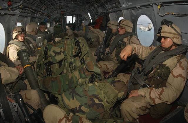 Fully geared U.S. Marines in helicopter about to be deployed in Afghanistan from the amphibious command ship USS Bataan. Dec. 14 2001., Photo by:Everett Collection(BSLOC_2011_6_27) Everett Collection(BSLOC_2011_6_27) PUBLICATIONXNOTxINxCANxCHNxFRAxITAxJPNxNORxPOLxRUSxESPxUKxUSA Copyright: xCourtesyxEverettxCollectionx HISL024 EC193