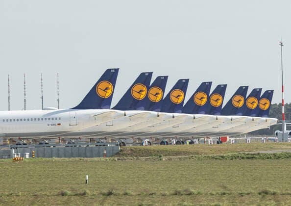 Lufthansa parks planes at BER airport, Due to the corona virus, worldwide demand for flights has fallen sharply, more and more flights are being cancelled Lufthansa planes with the crane logo are parked at BER airport The turbines and tyres have been covered to protect them Schoenefeld Brandenburg Germany
