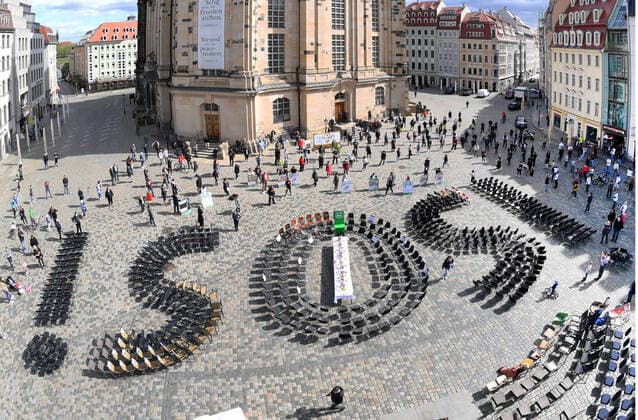GER Sachsen Dresden Neumarkt for the third time on a Friday in a row there was a demo with a table of Dresdens innkeepers and restaurateurs where they put out lots of chairs and put up a huge SOS of chairs in front of the Frauenkirche on the Neumarkt 010520 ddbd