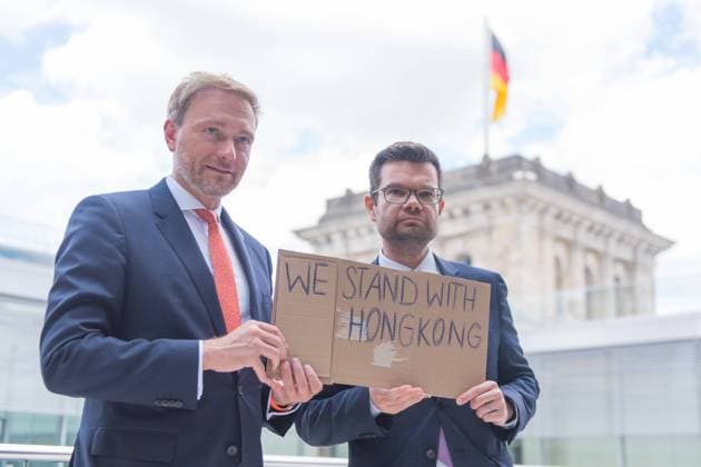 Berlin, Press Conference FDP Faction Germany, Berlin 30 06 2020 In the picture Christian Lindner Federal Chairman FDP and Marco Buschmann FDP can be seen with a WE STAND WITH HONGKONG sign in the German Bundestag before the press conference of the Faction Berlin Bundestag Berlin Germany