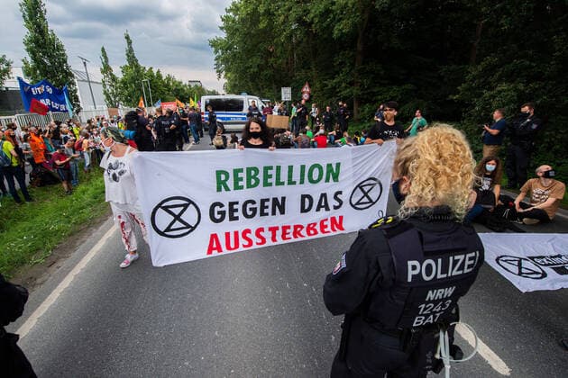 17 07 2020 Environmental activists blockade street near Tönnies main factory Demonstrators with a sitting blockade , Rheda Wiedenbrück Nordrhein Westfalen Germany