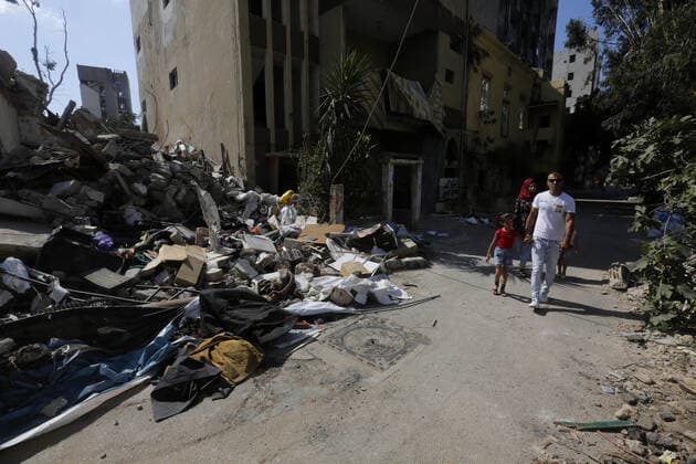 September 9, 2020, Beirut, Beirut, Lebanon: Lebanese walk beside the rubble near the site of blast in Beirut s port area, Lebanon August 9, 2020, in the aftermath of a colossal explosion that occurred days prior due to a huge pile of ammonium nitrate that had languished for years at a port warehouse. The huge chemical explosion that hit Beirut s port, devastating large parts of the Lebanese capital and claiming over 150 lives, left a 43-metre (141 foot) deep crater, a security official said. The blast Tuesday, which was felt across the country and as far as the island of Cyprus, was recorded by the sensors of the American Institute of Geophysics (USGS) as having the power of a magnitude 3.3 earthquake Beirut Lebanon - ZUMAap3_ 20200909_zaf_ap3_024 Copyright: xMarwanxTahtahx