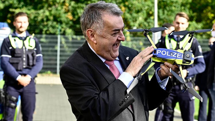 North Rhine-Westphalia introduces drones to the police Interior Minister Herbert Reul presents the new police drones at a press event at the Neuss LAFP NRW training centre The police in North Rhine-Westphalia NRW will be equipped with 106 drones from 2021 Interior Minister Herbert Reul,holds a police drone beaming with joy,photographed on 12 10 2020 in Neuss Â