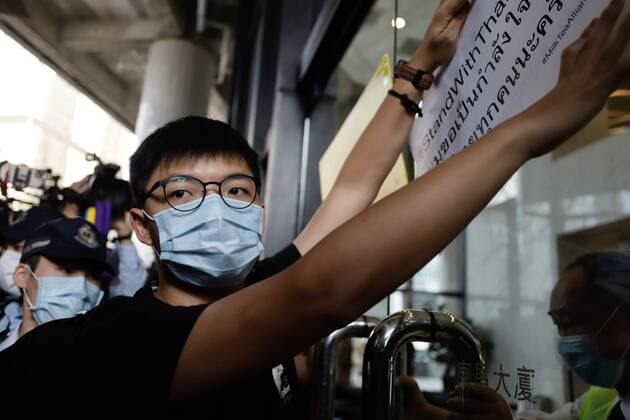 October 19, 2020, Hong Kong, CHINA: Joshua Wong, prominent Hong Kong political activist attempt to stick banner written in Thai script onto the main gate downstairs of Consulate General of Thailand after he was denied entrance to the building.Small group of Hong Kong pro-democracy lawmakers and political activists led by Joshua Wong staged demonstration outside Consulate General of Kingdom of Thailand calling for support for protesters and current pro-democracy movement in Thailand.Oct-19,2020 Hong Kong.ZUMA Hong Kong CHINA - ZUMAl137 20201019_zap_l137_004 Copyright: xLiauxChung-renx