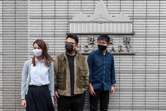 November 23, 2020, Hong Kong, China: Agnes Chow Ting (L), Ivan Lam Long Ying (C), and Joshua Wong Chi-fung (R) arrive at the West Kowloon Law Courts building on November 2020 in Hong Kong, China. The pro-democracy activists Joshua Wong, Ivan Lam and Agnes Chow were taken into custody after they pled guilty to inciting and organizing an unauthorized assembly related to last year protest. Hong Kong China - ZUMAs197 20201123_zaa_s197_169 Copyright: xMiguelxCandelax
