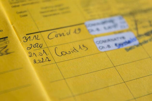Nuremberg, Germany 23 January 2021 A vaccination card lies on a table, in the vaccination book two vaccinations for Covid 19 are registered, thus the person is protected against an infection with the coronavirus Bavaria Copyright: xFotostandx xK.xSchmittx