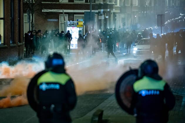 On Beijerlandselaan in South Rotterdam, The Netherlands, a group of about fifty young people has sought confrontation with the police due to the introduction of a curfew as a corona measure, January 25, 2021 The group stands and pelts the police present with stones and fireworks ANP MEDIATV KILLIAN LINDENBURG  Copyright: xHollandsexHoogtex xxANPx x427562014x