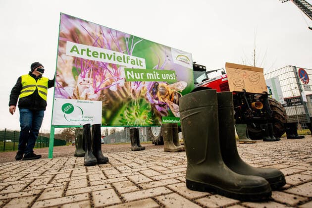 Erfurt , 05 02 2021 , Farmers demo in front of the Thuringian state parliament, stop action program insect protection In the picture Thuringian farmers demonstrate with green crosses and boots symbol for closed farms in front of the Steigerwald stadium plenary session Corona conditional