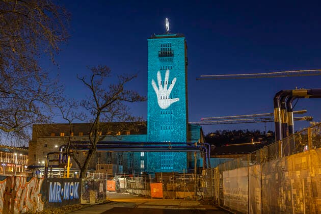 International Day of Rare Diseases Colourfully illuminated buildings draw attention to these diseases Here the station tower with Bonatzbau Stuttgart Central Station is taking part this year in the campaign of the Rare Disease Day initiative 28 02 2021 Germany, Baden Württemberg, Stuttgart