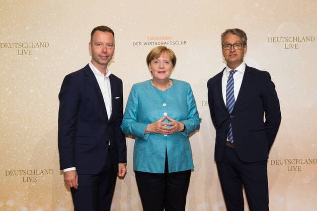 Sven Afhüppe Handelsblatt Editor-in-Chief , Angela Merkel and Gabor Steingart Handelsblatt Publisher at the event Deutschland Live Wohin treibt der Westen of the Handelsblatt Wirtschaftsclub at the Westhafen Event Convention Center WECC in Berlin Copyright: xEventpressxGolejewskix