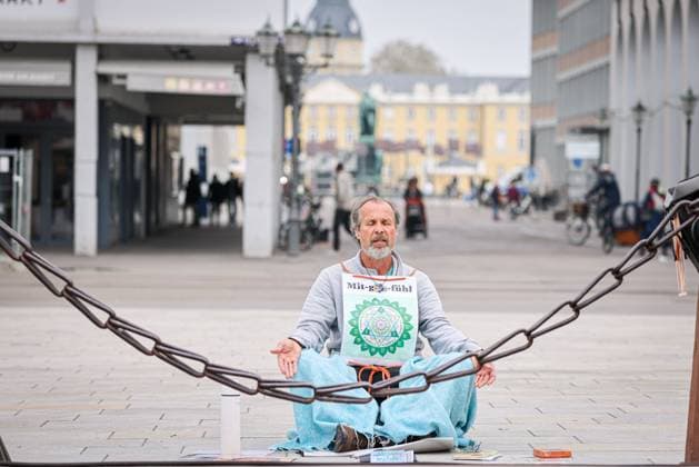 Labour Day Karlsruhe on 01 05 2021 in Karlsruhe , Germany A man meditates peacefully on the market place Karlsruhe, on Labour Day Karlsruhe Baden Württemberg Germany