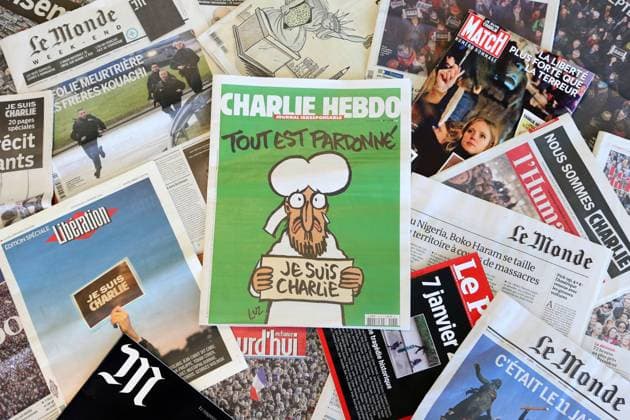 France, on 2015 01 14: front page of daily or weekly newspapers, from which the Charlie Hebdo satirical magazine France, on 2015 01 14: front page of daily or weekly newspapers, from which the Charlie Hebdo satirical magazine with its first publication after the shooting attack which resulted in the death of 12 people at the Charlie Hebdo offices on January 7, 2015. Its front cover depicts prophet Muhammad holding up a sign reading All is forgiven , on a green background. The satirical newspaper is in the middle of numerous other magazines and newspapers (from which Liberation, Le Monde, La Croix, Le Point, L Humanite, JDD, Aujourd hui en France, etc...) Eurasia; Europe; Western Europe; France Copyright: xBigot Andia.frx 263310