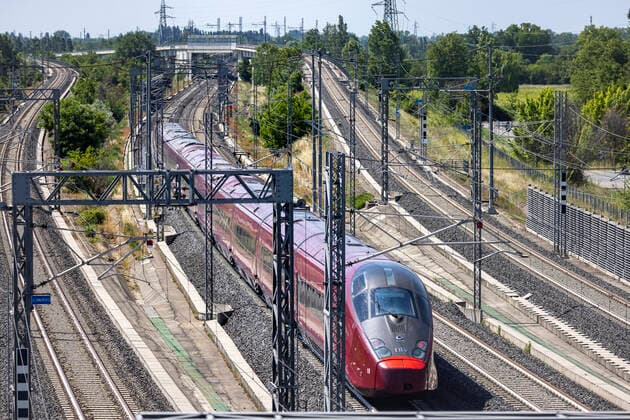 Italo Nuovo Trasporto Viaggiatori NTV is a private Italian railway company It provides high-speed rail services between major Italian cities in competition with the state-owned T r e n i t a l i a High-speed railway line near Castelfranco Emilia 27 05 2021 ITA, Italy, Castelfranco Emilia