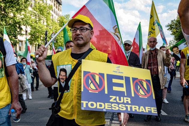 Iranian exiles and supporters of the National Council of Resistance of Iran NCRI protest against the Iranian government in Berlin The demonstrators demand more human rights and the abolition of the death penalty snapshot photography M Czapski