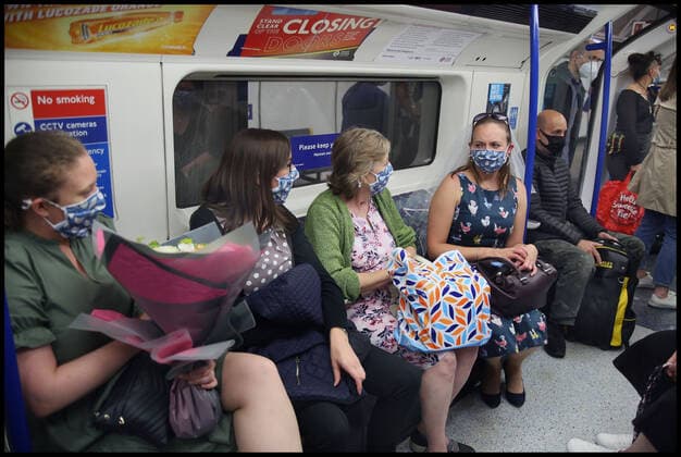 September 5, 2020, London, United Kingdom: Passengers on the London Underground on the way to a hen party wear matching face coverings, during the covid 19 restrictions period..After more than a year of restrictions for travellers™ mandatory face mask wearing and social distancing will end (on Monday 19th July). The government has still advised the wearing of face masks and allowing extra space in crowded spaces indoors. London United Kingdom - ZUMAs197 20200905_zaa_s197_214 Copyright: xMartinxPopex