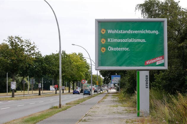 12 08 2021, xtgx, politics, advertising for the Bundestag elections in Wolfsburg, campaign against the Greens At numerous locations in Wolfsburg are posters of the campaign Gruener Mist The AfD close company Conervare Communication GmbH spreads on these posters derogatory slogans about the Greens Wolfsburg