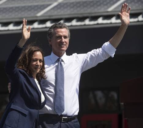 California Governor Gavin Newsom waves with Vice President Kamala Harris at a vote no on recall rally at the IBEW-NECA Joint Apprenticeship Training Center in San Leandro, California on Wednesday, September 8, 2021. Harris joined the Governor to urge voters to defeat the Republican lead recall with less than a week of voting to go.  SXP2021090815 TERRYxSCHMITT
