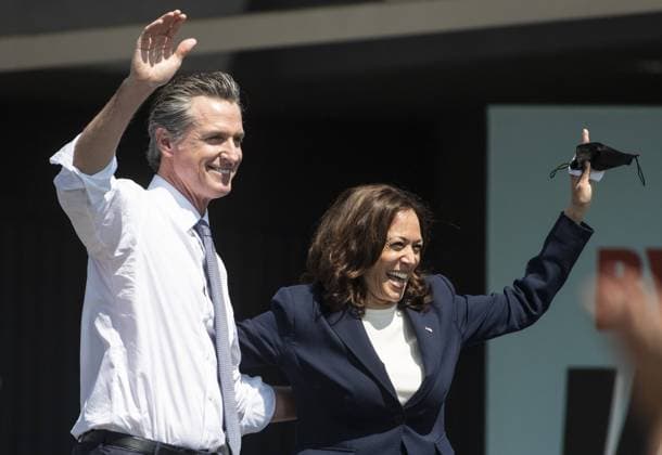 California Governor Gavin Newsom waves with Vice President Kamala Harris at a vote no on recall rally at the IBEW-NECA Joint Apprenticeship Training Center in San Leandro, California on Wednesday, September 8, 2021. Harris joined the Governor to urge voters to defeat the Republican lead recall with less than a week of voting to go.  SXP202109081 TERRYxSCHMITT