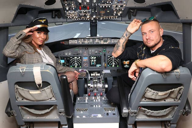Cora Schumacher and Eric Sindermann at the photo session in a flight simulator at the historic airport on 27 10 2021 at Motorworld Cologne Heavenly outing for Cora Schumacher in Cologne