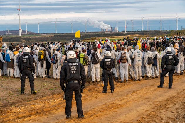 Protest action against the demolition of the village of Lützerath in the Rhenish lignite mining area, which is to make way for the expansion of the Garzweiler II open pit mine, activists wanted to occupy a spoil excavator, but were stopped by the police at the spoil edge, Lützerath, NRW, Germany, lignite protests