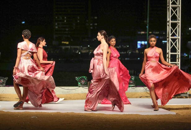 (211114) -- COLOMBO, Nov. 14, 2021 -- Models present creations during Colombo Fashion Week in Colombo, Sri Lanka, Nov. 13, 2021. The two-day Colombo Fashion Week this year in Sri Lanka was concluded with the last-day show held Saturday night at the marina of the Colombo Port City. (Photo by Xinhua) SRI LANKA-COLOMBO-FASHION WEEK AjithxPerera