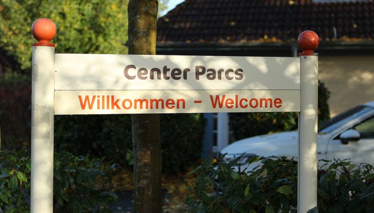 Welcome sign in front of houses at Center Parcs holiday park in Tossens Tossens Lower Saxony