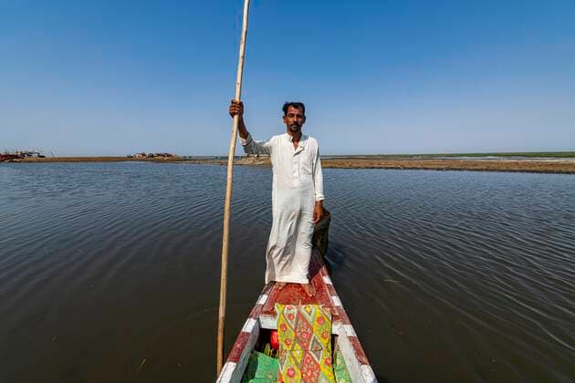 Marsh Arabian on his boat, Mesopotamian marshes, Ahwar in southern Iraq, Unesco site, Iraq, Asia Copyright: imageBROKER/MichaelxRunkel iblrun07166722.jpg