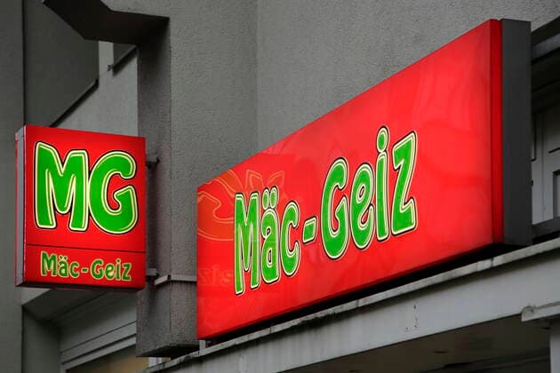 12 01 2022, Berlin, Germany Photo illuminated sign with logo and lettering at a branch of the low-price chain Maec Geiz in Berlin, Germany