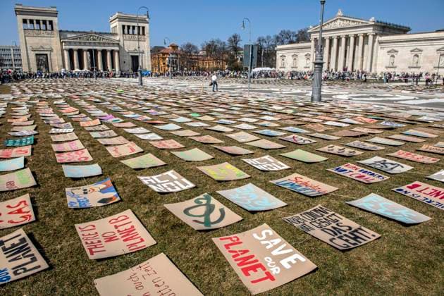 Art action of Fridays for Future, at the Global Climate Strike, rally on Königsplatz, Munich, 25 March 2022 Germany, Munich, 25 03 2022, Global Climate Strike, art action, hundreds of posters on climate, politics and environment cover half of Königsplatz, ra
