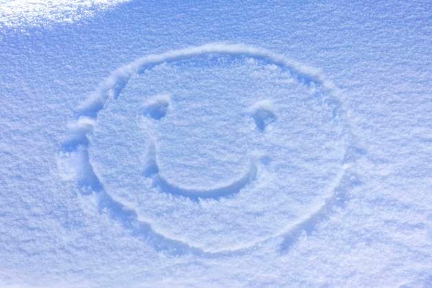 Friendly smiley face drawn in the snow Smiley in Snow
