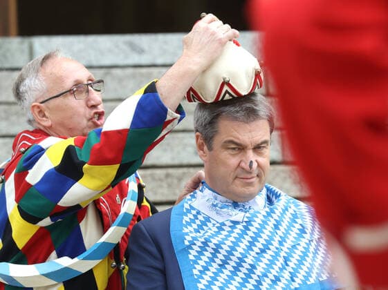 Traditional Schäfflertanz in the garden of the Bavarian State Chancellery Dr Markus Söder Soeder lets the Schäffler dance in the garden of the State Chancellery Markus Söder gets the fool cap put on, Munich Bavaria Germany garden of the State Chancellery
