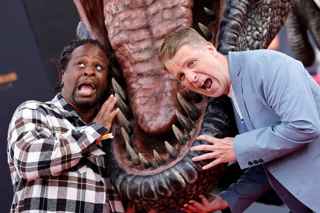 Presenter Mola Adebisi and entertainer Oliver Pocher in front of a T Rex at the German premiere of Jurassic World A New Age at the Cinedom cinema Cologne, 30 05 2022 NRW Germany Copyright: xChristophxHardtx