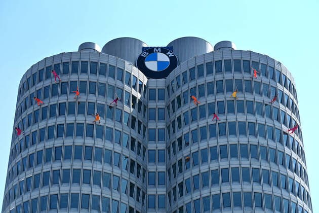 Artists, high-rise climbers abseiling Jubilee event ã50 years BMW high-riseÒ on 22 07 2022 in Munich